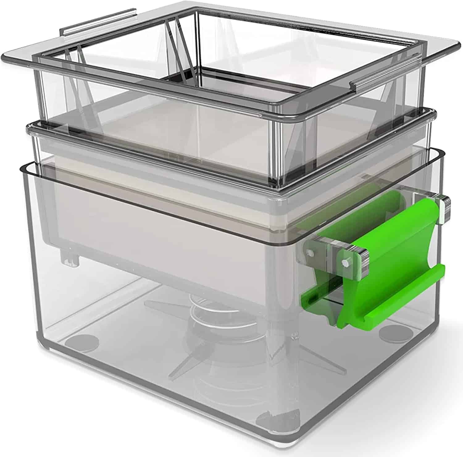 Transparent tofu press with stacked trays and a green handle on the side, featuring a spring mechanism at the bottom.
