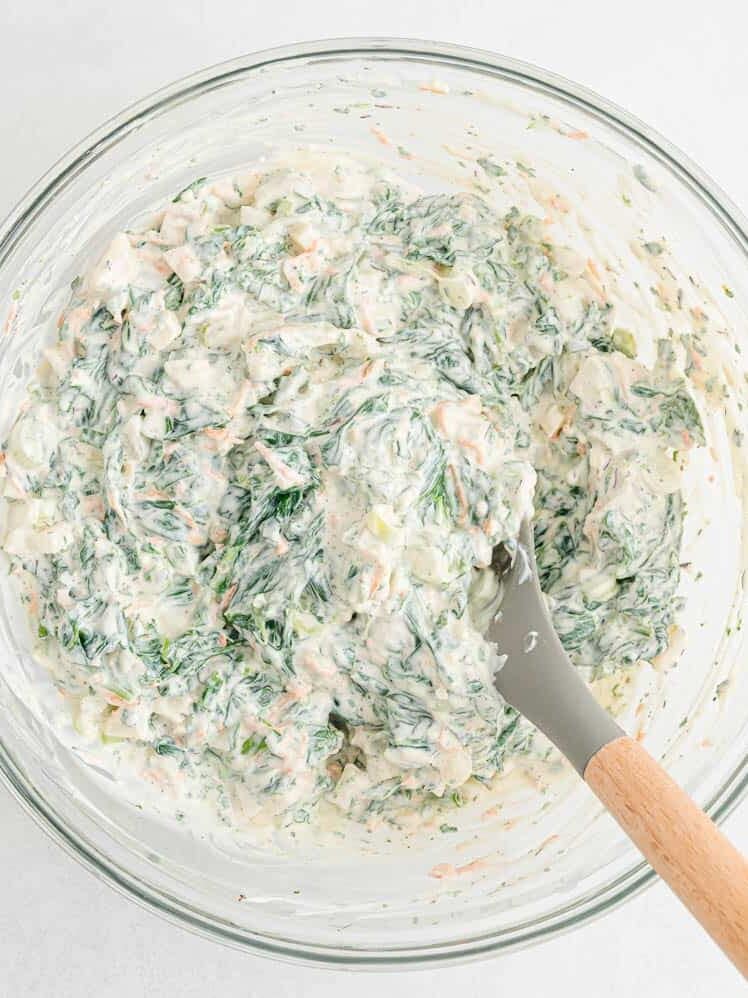 Spinach dip ingredients mixed together.