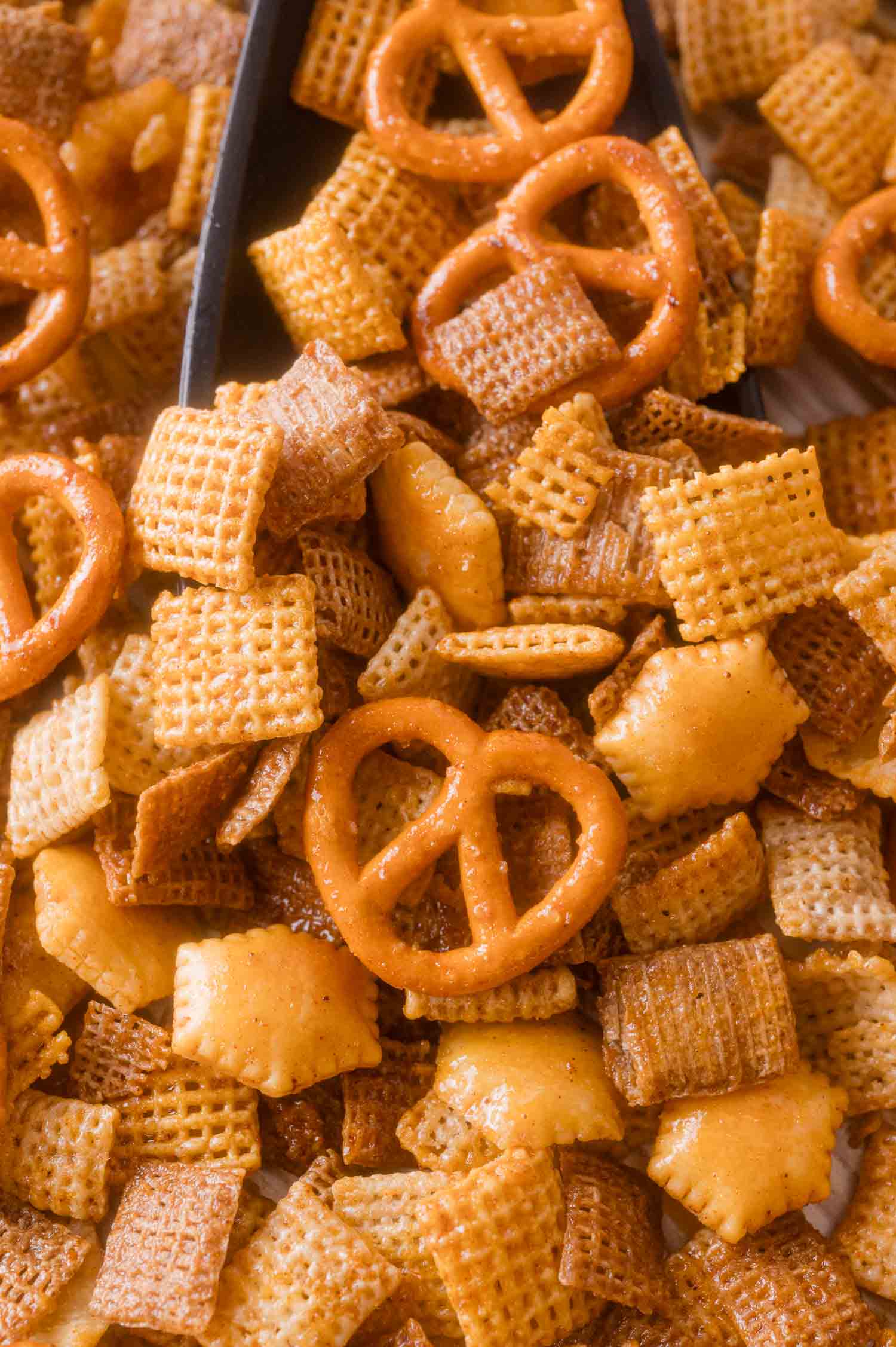 A mix of seasoned square cereal, pretzels, and crackers.